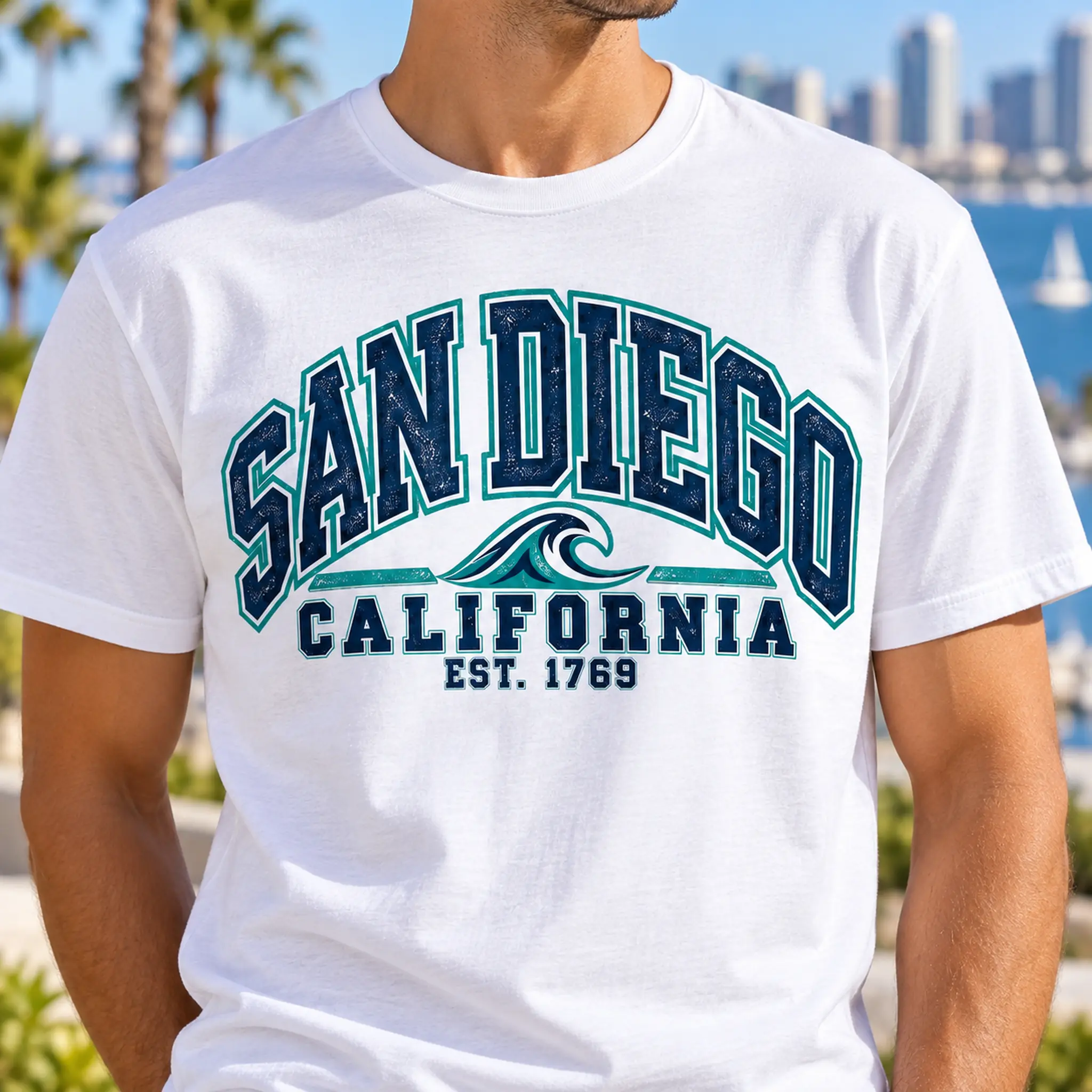 Close-up of the navy and teal San Diego Wave graphic printed on a white T-shirt.